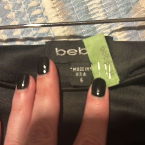 Pre-loved sexy Bebe skirt (satin feel) see pic of tag with actual material. - Picture 6 of 9